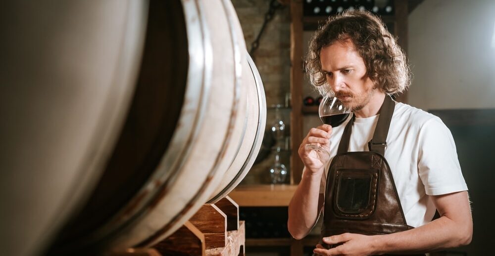 Photo of a sommelier smelling wine for investment purposes
