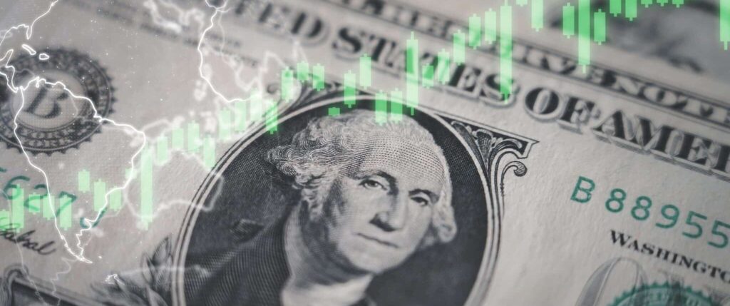 Photo of a dollar and a graph representing the evaluation of a wine investment.