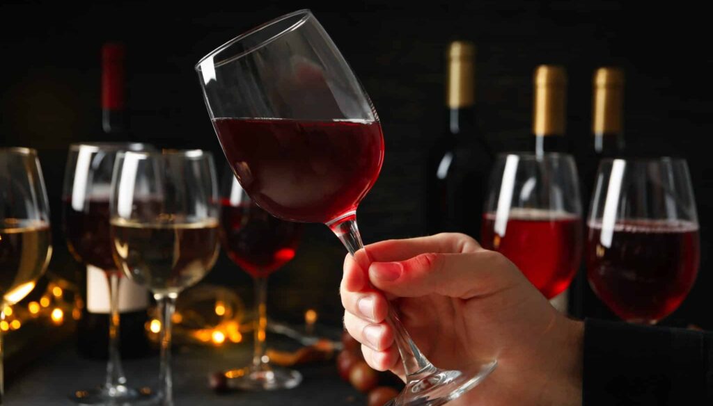 Three glasses of Bordeaux red wine showing subtle color variation