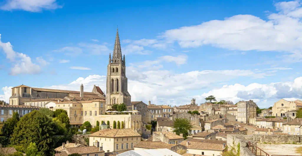 The bell tower of Saint-Émilion above the classified vineyards